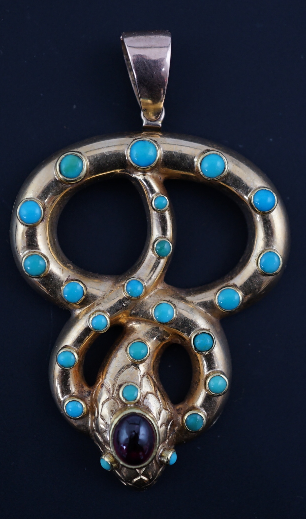 A Victorian gold, turquoise and cabochon garnet set entwined serpent pendant